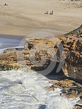 View of a Sea Cave at Praia do Norte (North Beach) in NazarÃ©, Portugal photo