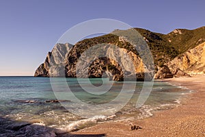 Praia Ribeira do Cavalo, a hidden beach of crystal clear blue waters near the town of Sesimbra