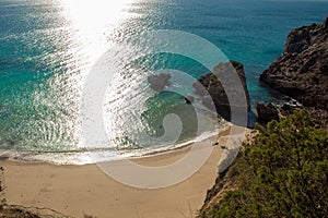 Praia Ribeira do Cavalo, a hidden beach of crystal clear blue waters near the town of Sesimbra photo