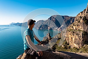 Praiano - Man enjoying the scenic view from hiking trail between Positano and Praiano at the Amalfi Coast, Campania, Italy, Europe