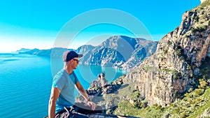 Praiano - Man enjoying the scenic view from hiking trail between Positano and Praiano at the Amalfi Coast, Campania, Italy, Europe