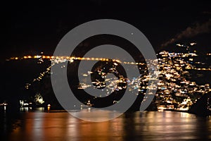 Praiano - Scenic view at night from Praiano to Positano at the Amalfi Coast, Campania, Italy, Europe. New years evening