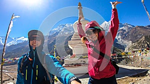 Praken Gompa - A couple posing with the white pagoda