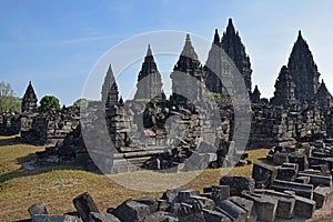 Prambanan Temples with stone ruins seen scattered outside the complex