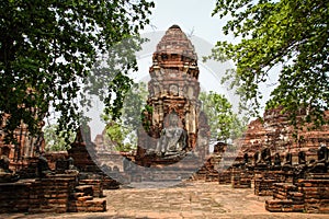 Prang and statue of Buddha, Wat Mahathat temple, Ayutthaya, Chao Phraya Basin, Central Thailand, Thailand