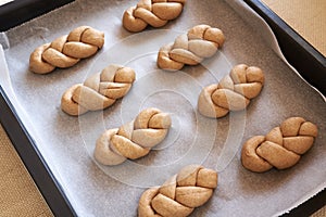 Praparation of braided bread buns or rolls from whole grain spelt flour