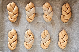 Praparation of braided bread buns from whole grain spelt flour, top view