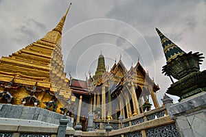 Prasat Phra Thep Bidon and golden chedi. Wat Phra Kaew (Temple of the Emerald Buddha). Bangkok. Thailand photo