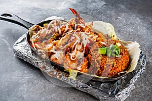 prawn fajitas with fried rice served in a dish isolated on dark background side view food