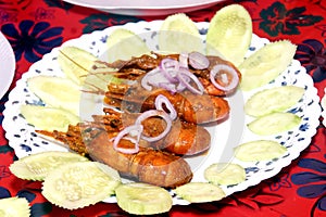 Prawn fish frayed  in a white plate . salad .