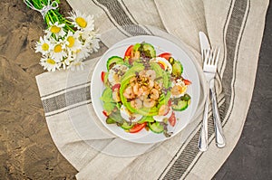 Prawn salad with cucumber and avocado, seeds, vegetables, lettuce