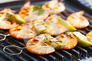 prawn skewers with lime on electric grill