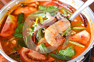 Prawn soup, Spicy soup with shrimp seafood coconut milk and chili pepper in pot, Hot and sour curry shrimps and squid Thai food