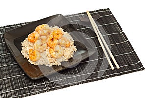 Prawns and fried rice on a mat