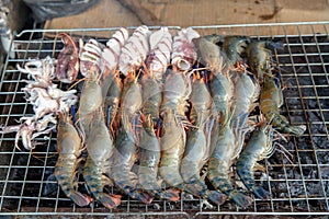 Prawns or shrimp grilled on charcoal stove. shrimp grilled bbq seafood on stove.