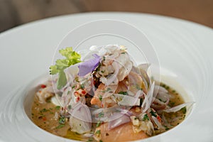 Prawns, white snapper, squid, salmon in a spicy orange dressing