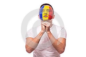 Pray for a goal Romanian football fan in game of Romania national team