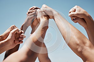 Pray, hands and community praying against a blue sky background for worship, praise and religion outside. Prayer, church