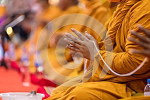 Pray of monks on ceremony of buddhist in Thailand. Many Buddha monk sit on the red carpet prepare to pray and doing Buddhist cerem