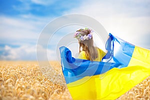 Pray for Ukraine. Child with Ukrainian flag