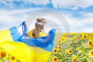 Pray for Ukraine. Child with Ukrainian flag
