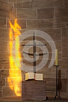 Prayer alcove with cross, book and candle
