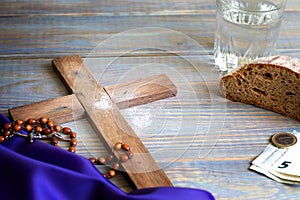 Prayer almsgiving fasting Ash Wednesday concept with wooden cross