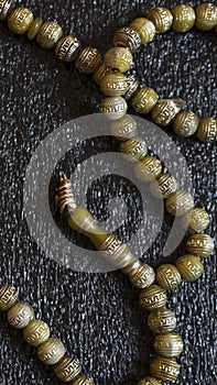 Prayer beads on dark background