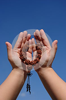 Prayer beads in her hands