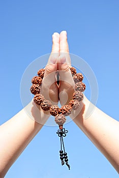 Prayer beads in her hands