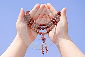 Prayer beads in her hands