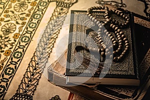 Prayer beads on Koran holy book of Muslims