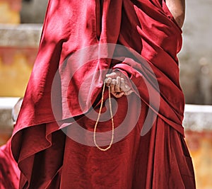Prayer beads in monk's hand