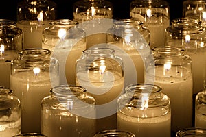 Prayer candles burning inside a church