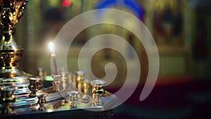 Prayer candles. Candle holder in the Russian Orthodox Christian Church. Scene. Church candles in sand candlesticks on