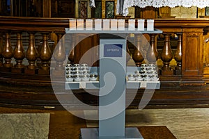 Prayer candles at a stand in a Catholic church. photo