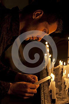 Prayer in church and candles