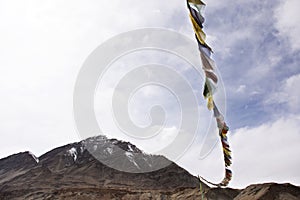 Prayer flag for blessing at viewpoint of Confluence of the Indus and Zanskar Rivers while winter season at Leh Ladakh in India