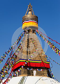 Prayer flags and Bodhnath stupa in Kathmandu, Nepal