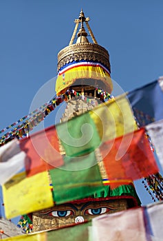 Prayer flags and Bodhnath stupa in Kathmandu, Nepal