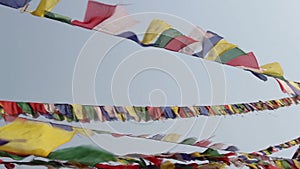 Prayer flags flying from Boudhanath Stupa, Buddhist Temple naer Kathmandu, Nepal