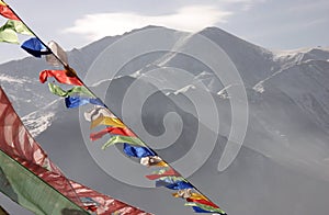 Prayer flags in front of the Yushu mountains