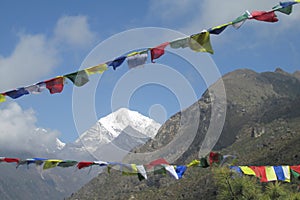 Prayer flags in Nepal trekking at Himalaya mountains