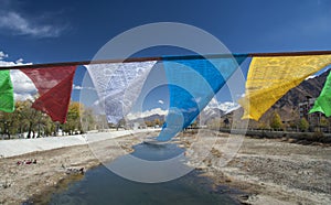 Prayer flags over river. Lhasa, Tibet, China