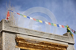 Prayer flags on roof of house at Leh Ladakh village at Himalayan valley in Jammu and Kashmir, India