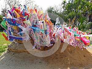 prayer flags on sand pagoda at temple in songkran festival.
