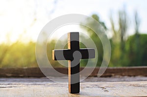 Cross on a wood background . Cross against the sky . photo