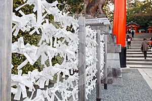 Prayer Papers Tied to Rope in Japanese Shrine - Spiritual Tradition and Sacred Offerings