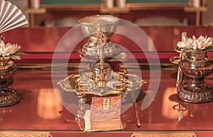 Prayer room of Gokokuji temple with sutra booklet, Gokorei bell and golden diamond Buddhist sword symbol of the indestructible and