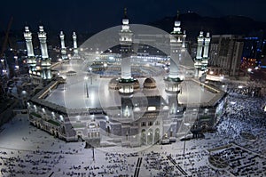 Prayer and Tawaf of Muslims Around AlKaaba in Mecca, Saudi Arabia photo